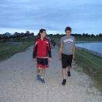 Morgan and Tyler walking around the campground lake