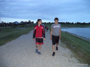 Morgan and Tyler walking around the campground lake
