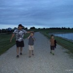 Steve Christian and Gabriel walking around the campground lake