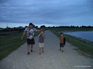 Steve Christian and Gabriel walking around the campground lake
