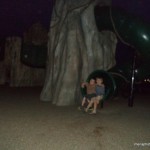Christian and Gabriel on the playset at night