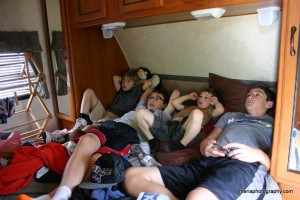 Boys lying on our bed watching a movie