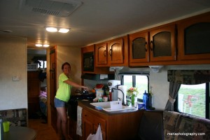 Marie at the stove in the camper